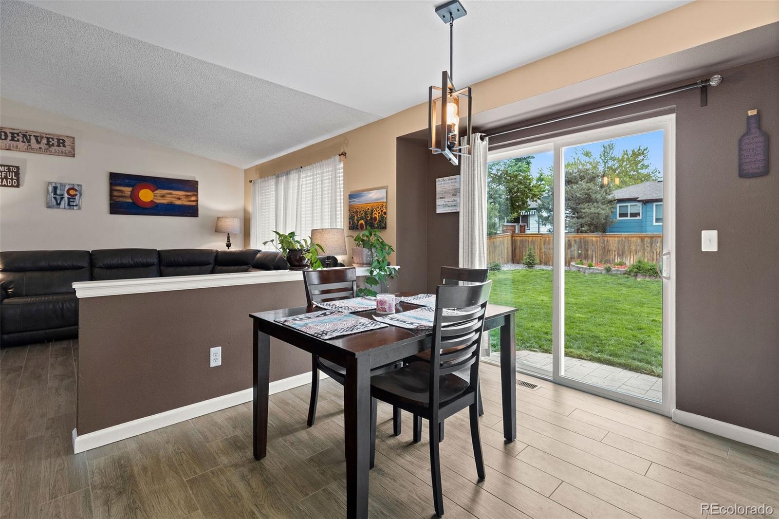 10565 Hyacinth Place Highlands Ranch, CO 80129 - Photo 10 of 33 a view of a dining room with furniture window and outside view