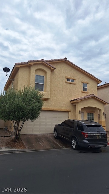 5171 Piazza Cavour Drive Las Vegas, NV 89156 - Photo 2 of 13 A traditional-style residence featuring an attached garage and a welcoming covered entry.