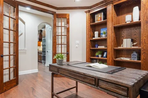 a room with furniture pool table and window