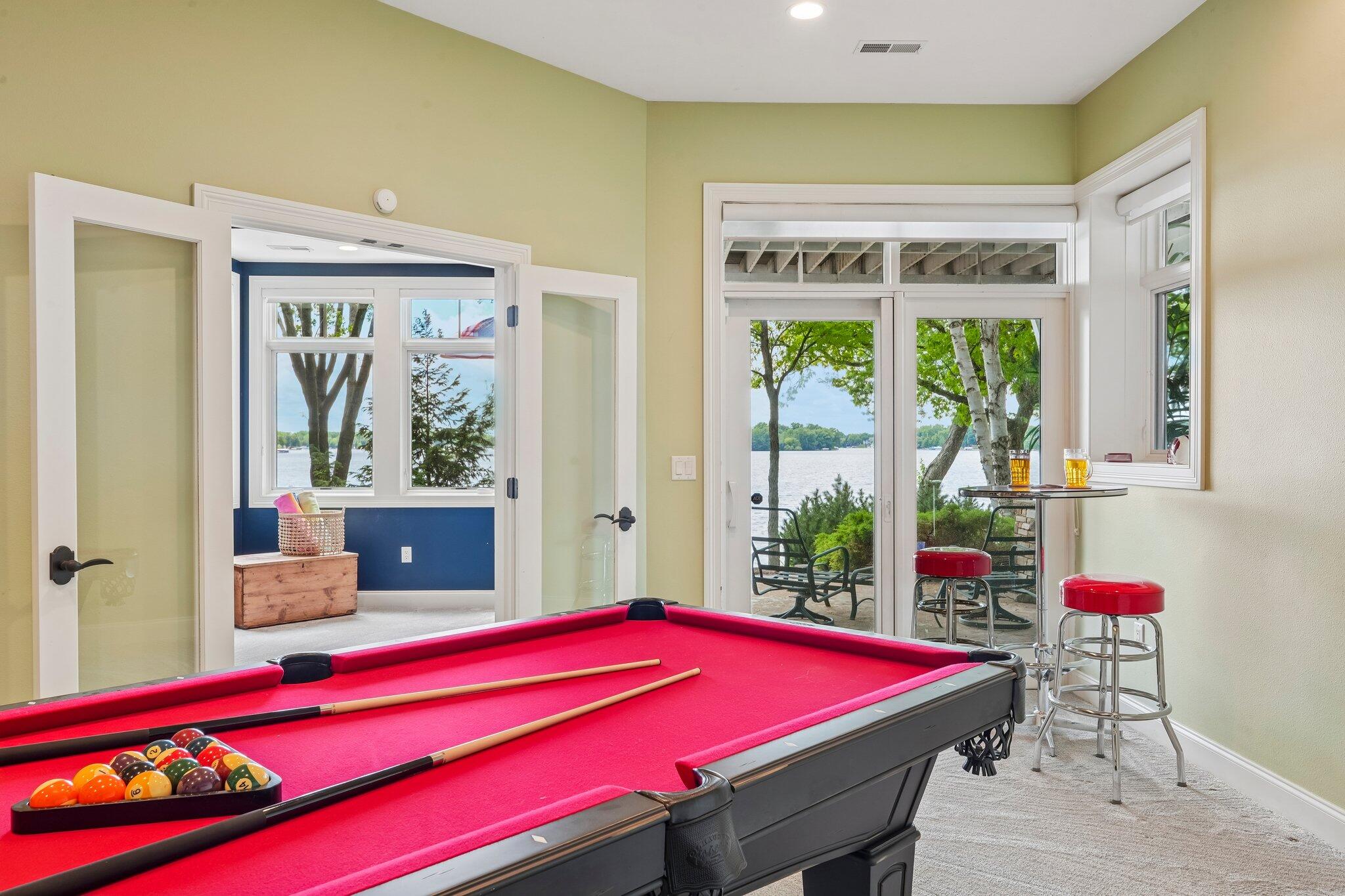 W343N6293 South Bayview Road Oconomowoc, WI 53066 - Photo 85 of 104 Billiard room with doors to patio