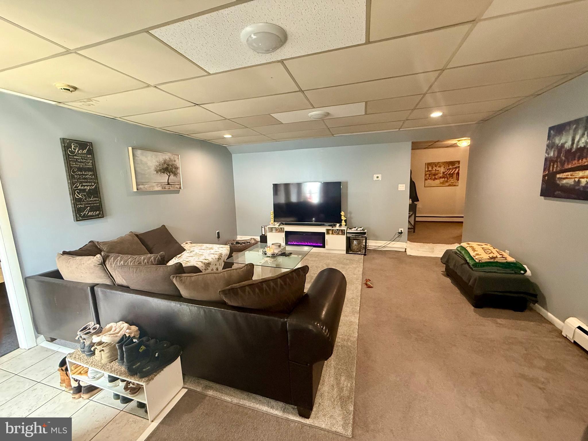 145 Spring Valley Road Reading, PA 19605 - Photo 13 of 44 a living room with furniture and a flat screen tv