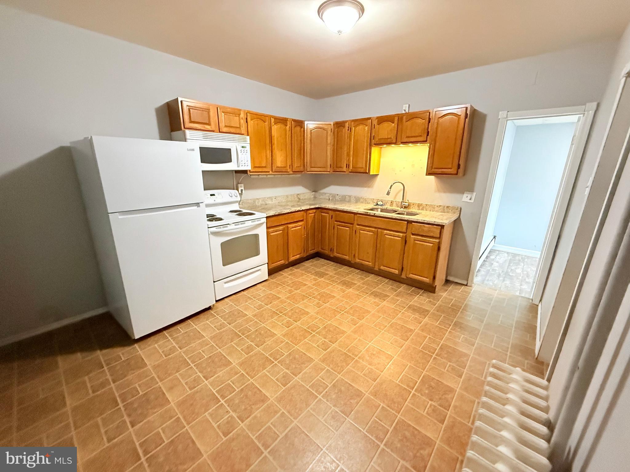 145 Spring Valley Road Reading, PA 19605 - Photo 40 of 44 a kitchen with stainless steel appliances a refrigerator and a stove