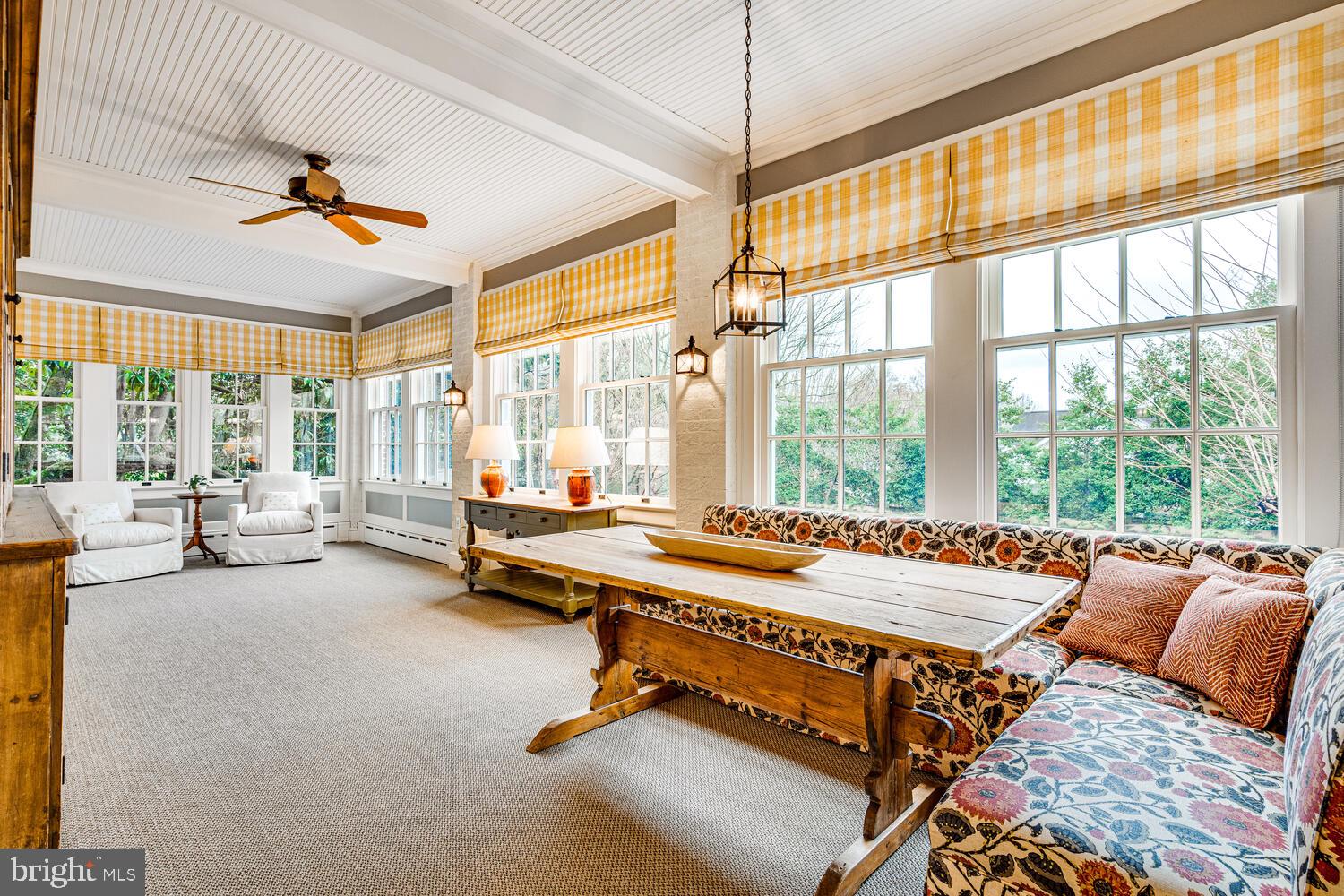 3512 Rittenhouse Street Northwest Washington, DC 20015 - Photo 34 of 132 a living room with furniture and floor to ceiling windows