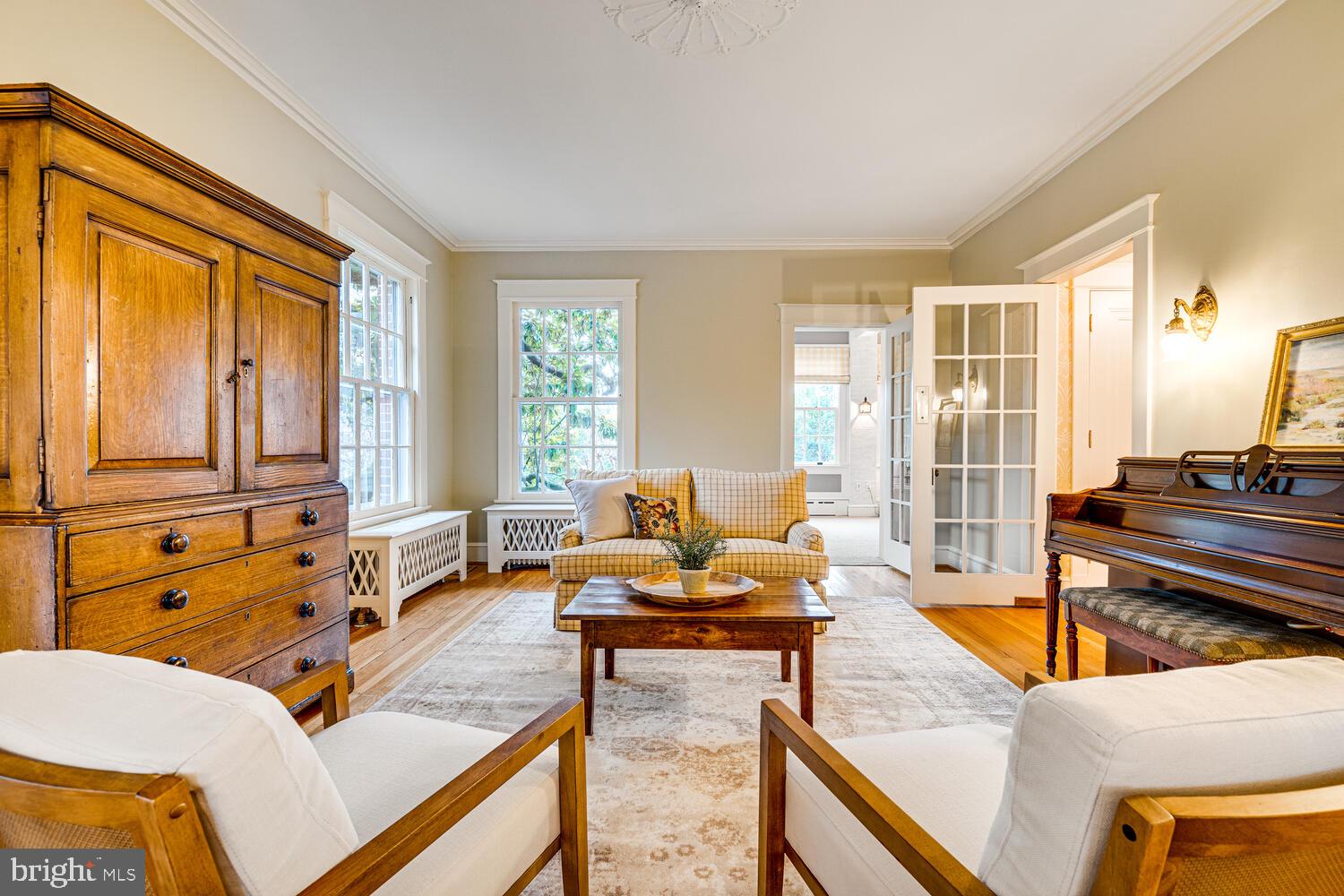 3512 Rittenhouse Street Northwest Washington, DC 20015 - Photo 37 of 132 a living room with furniture and floor to ceiling windows