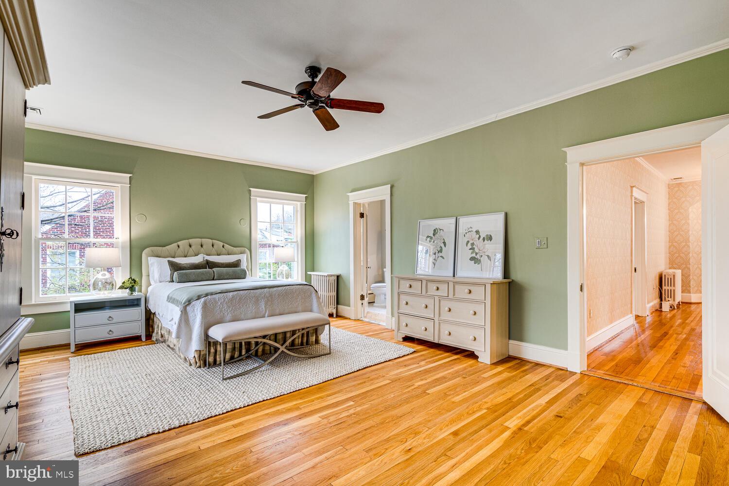 3512 Rittenhouse Street Northwest Washington, DC 20015 - Photo 52 of 132 a spacious bedroom with a bed and wooden floor