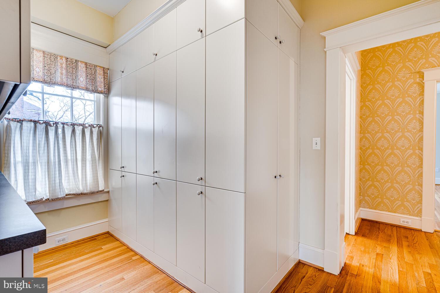 3512 Rittenhouse Street Northwest Washington, DC 20015 - Photo 68 of 132 a view of a room with wooden floor and windows
