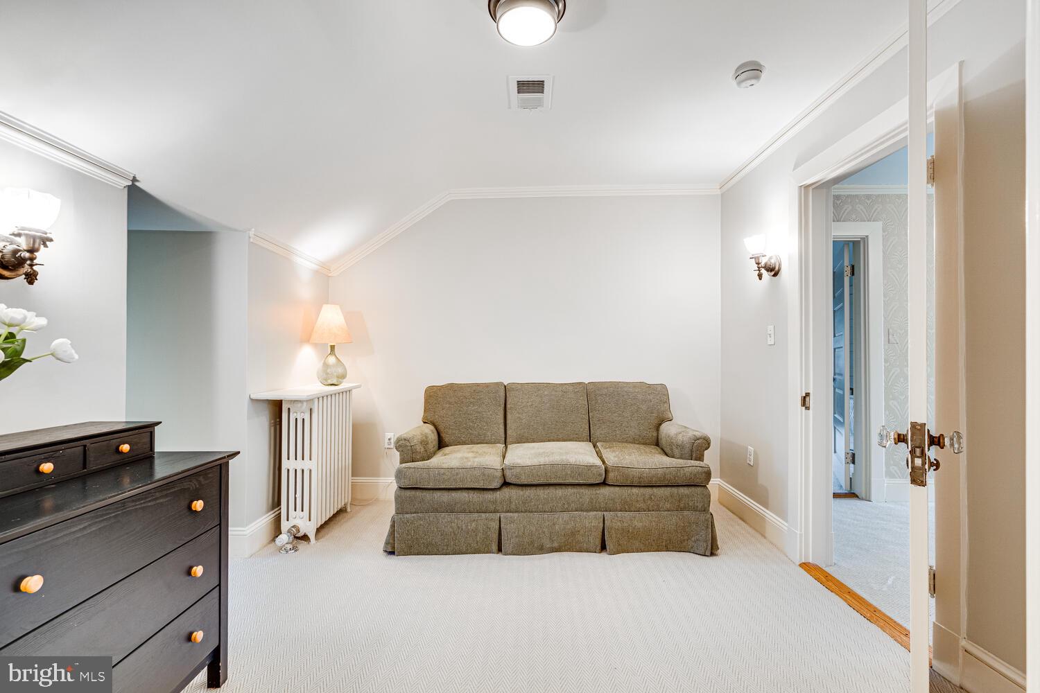3512 Rittenhouse Street Northwest Washington, DC 20015 - Photo 71 of 132 a living room with furniture a lamp and a window