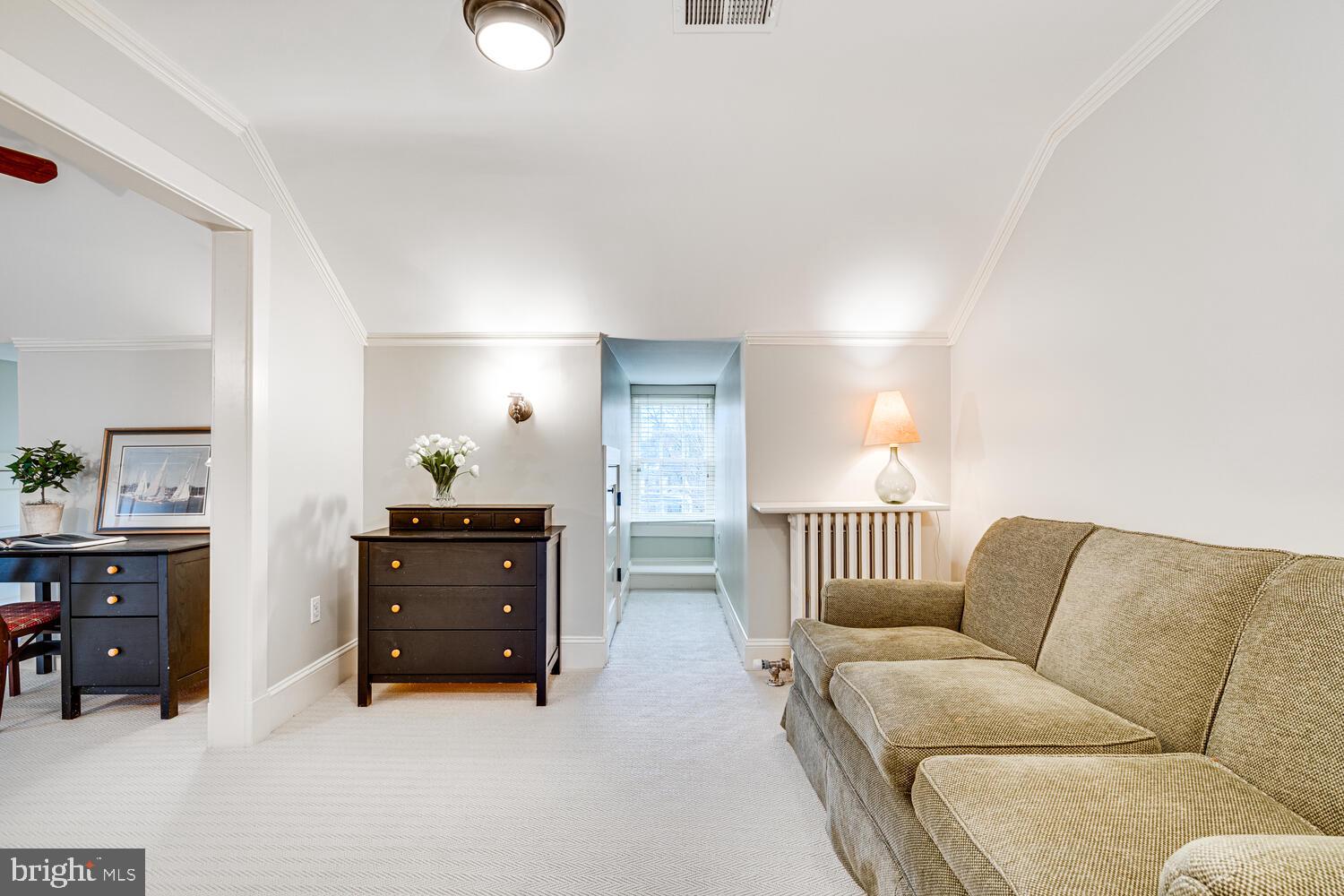 3512 Rittenhouse Street Northwest Washington, DC 20015 - Photo 73 of 132 a living room with furniture and a lamp