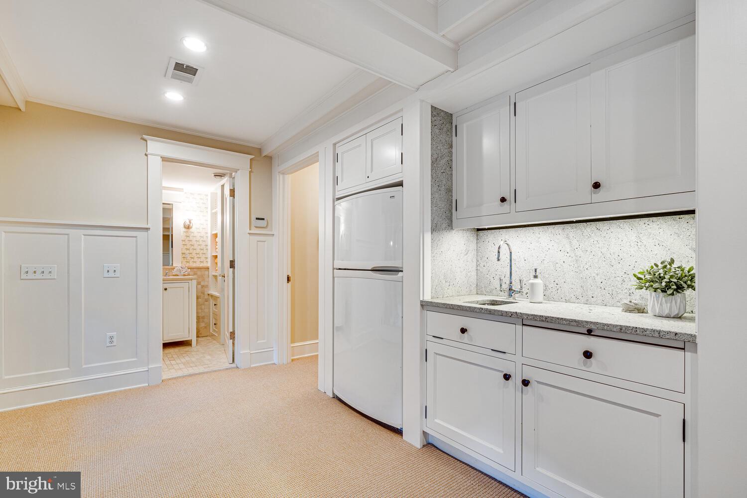3512 Rittenhouse Street Northwest Washington, DC 20015 - Photo 83 of 132 a kitchen with white cabinets and refrigerator