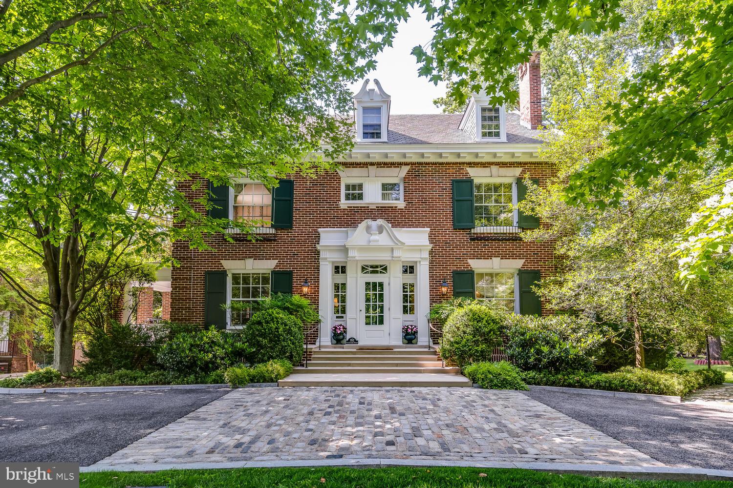 3512 Rittenhouse Street Northwest Washington, DC 20015 - Photo 96 of 132 a front view of a house with a garden