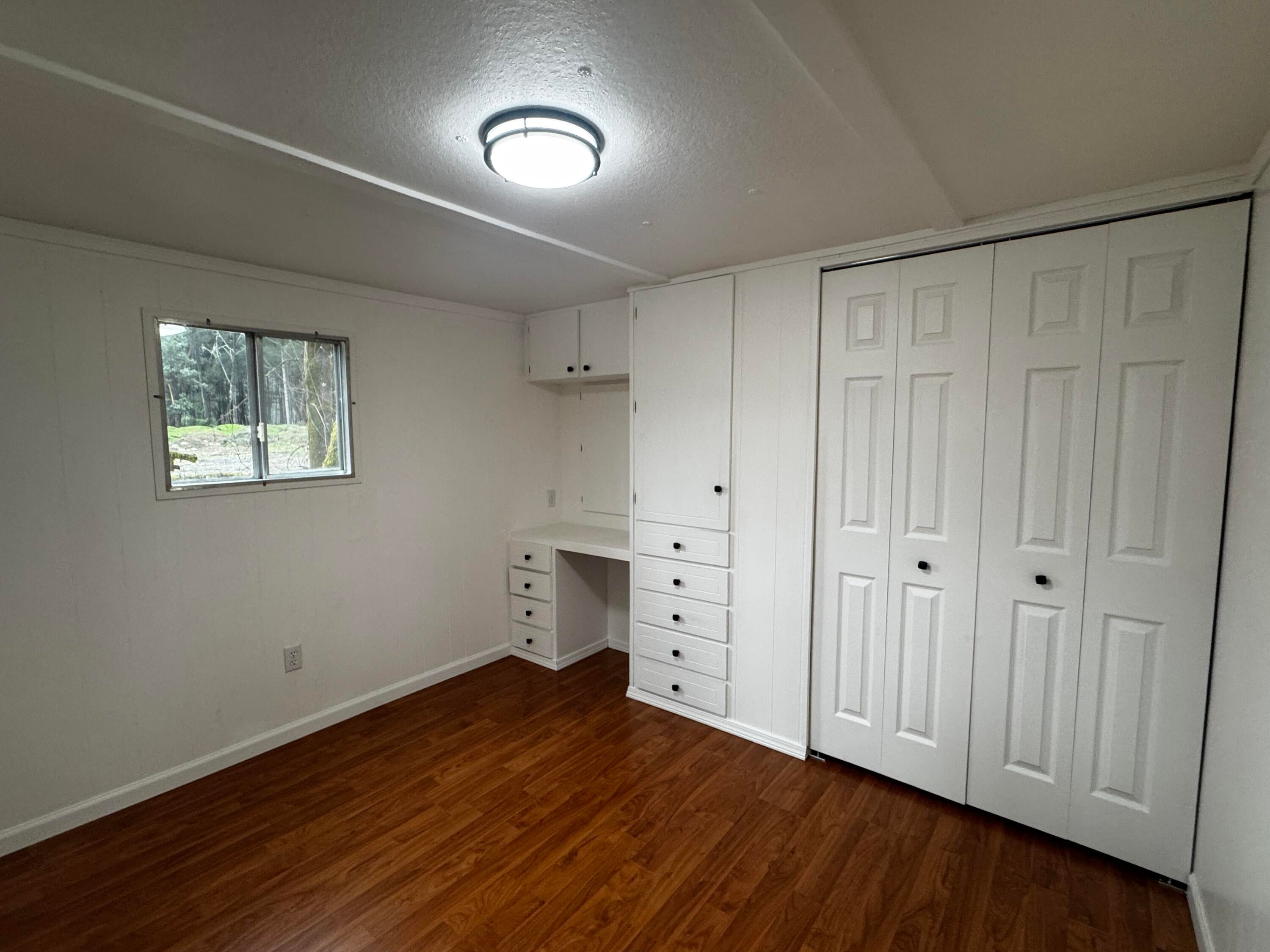 9566 Old Stage Road, Unit 27 Central Point, OR 97502 - Photo 6 of 12 Primary bedroom with tons of storage