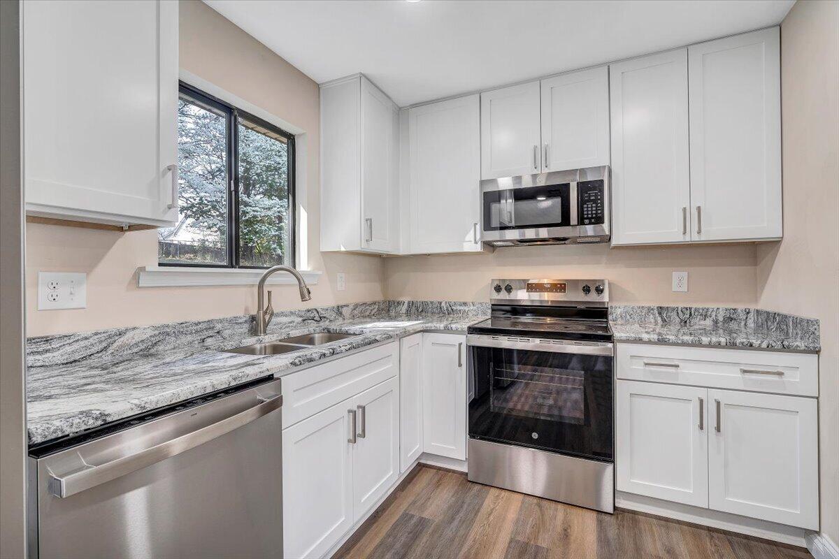 2159 Beavers Lane Vinton, VA 24179 - Photo 11 of 45 a kitchen with stainless steel appliances granite countertop a stove a sink and a microwave