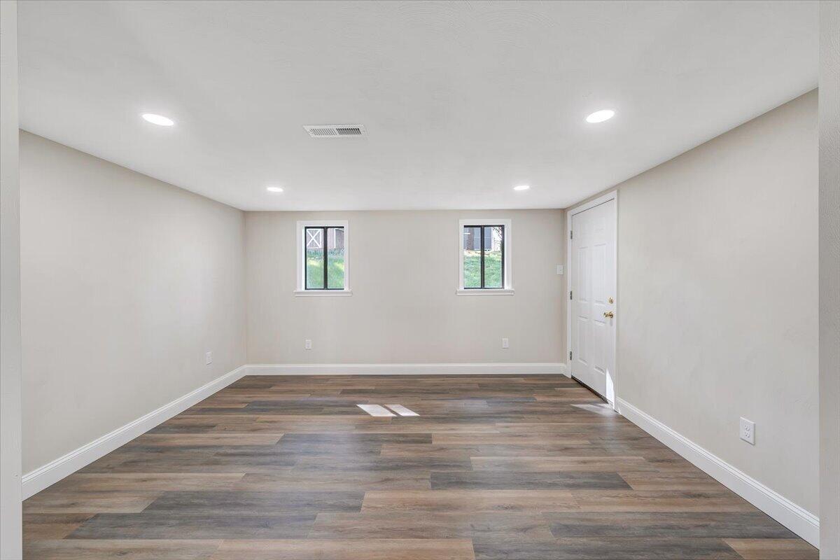 2159 Beavers Lane Vinton, VA 24179 - Photo 14 of 45 a view of an empty room with wooden floor and a window