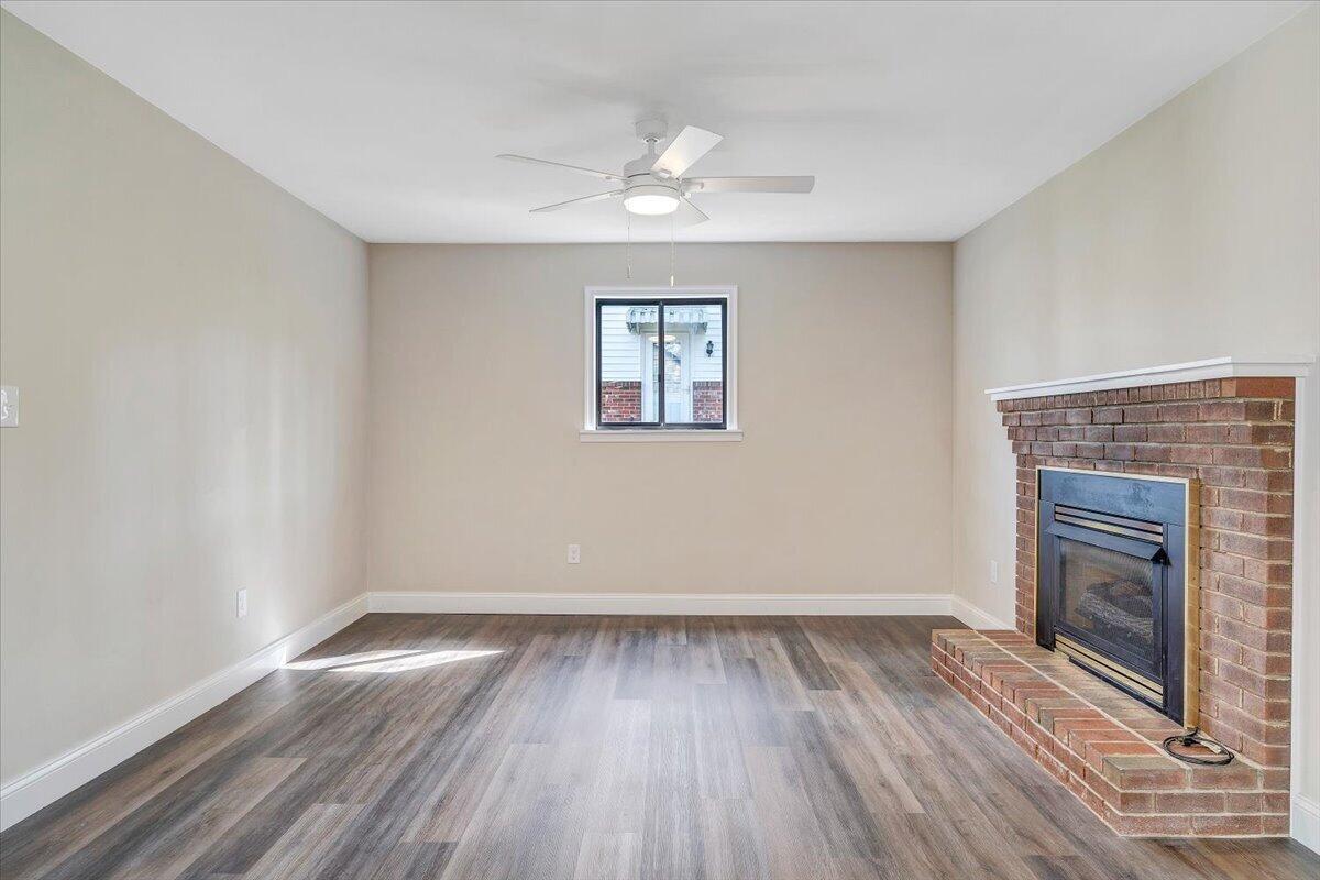 2159 Beavers Lane Vinton, VA 24179 - Photo 19 of 45 wooden floor in an empty room with a fireplace