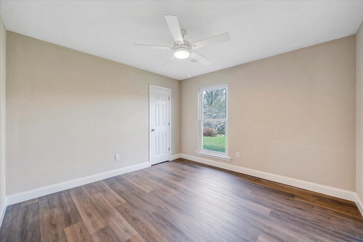 2159 Beavers Lane Vinton, VA 24179 - Photo 30 of 45 a view of an empty room with wooden floor and a window