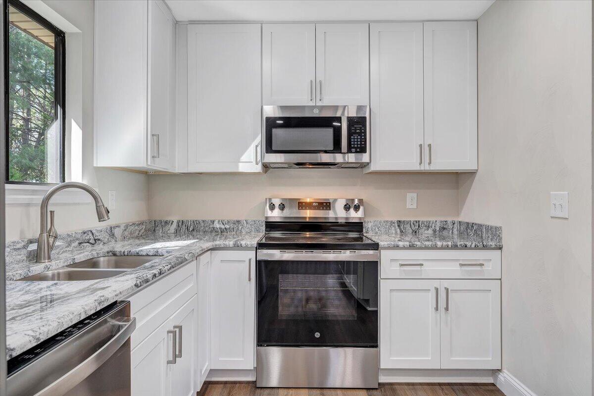 2159 Beavers Lane Vinton, VA 24179 - Photo 10 of 45 a kitchen with white cabinets and stainless steel appliances