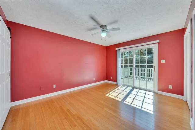 a kitchen with stainless steel appliances granite countertop a sink dishwasher a stove a refrigerator with a dining table and chairs