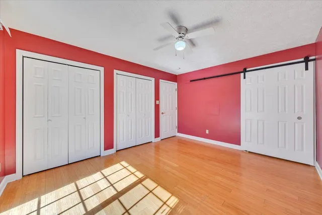 a kitchen with stainless steel appliances kitchen island granite countertop a stove a sink and a refrigerator