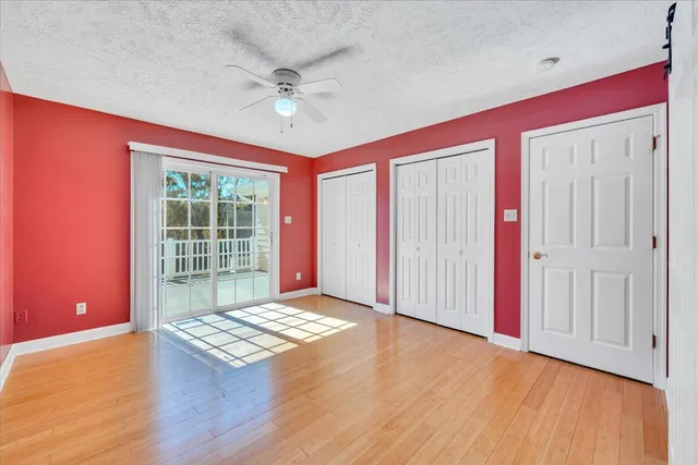 a living room with furniture rug and kitchen view