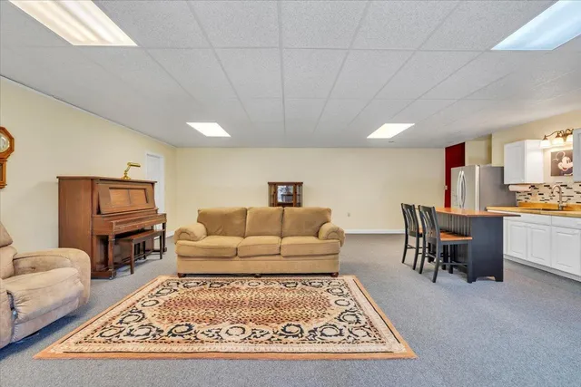 a view of a swimming pool with an outdoor space and seating area