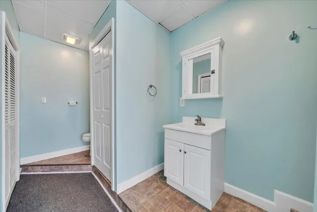 an aerial view of residential house with swimming pool and green space