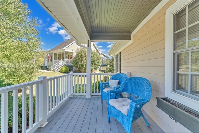 an aerial view of ocean with residential house and outdoor space