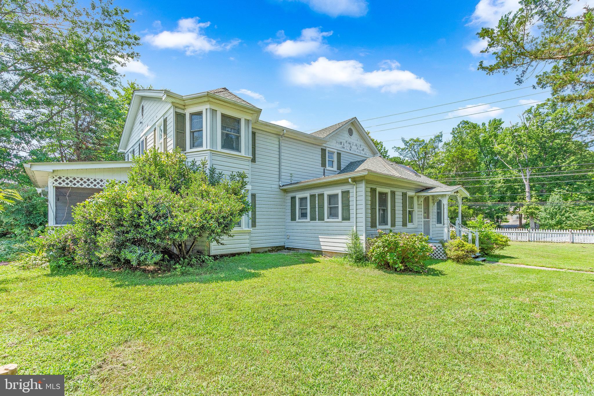 2440 Hallowing Point Road Prince Frederick, MD 20678 - Photo 37 of 51 a front view of a house with a garden