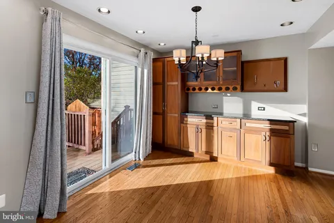 a view of a kitchen with a sink and microwave