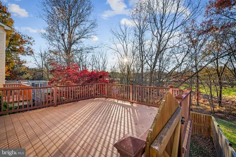 a view of a balcony with wooden deck