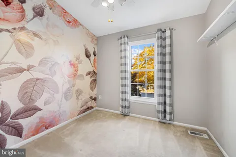 a view of walk in closet with window