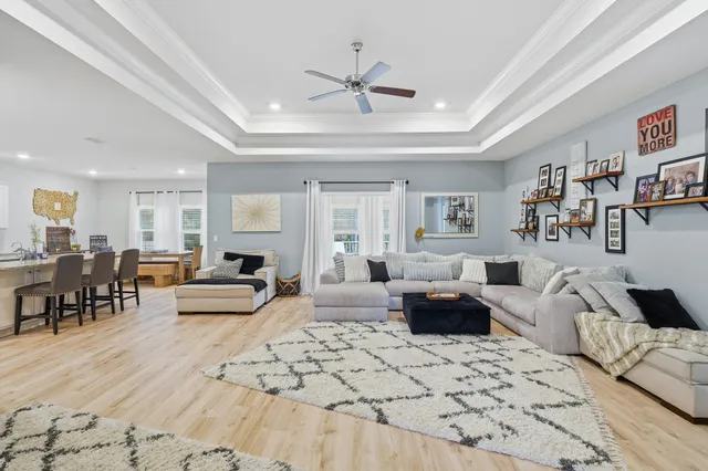 a view of a livingroom with furniture and a flat screen tv