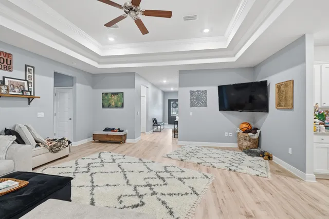 a bedroom with furniture and a flat screen tv