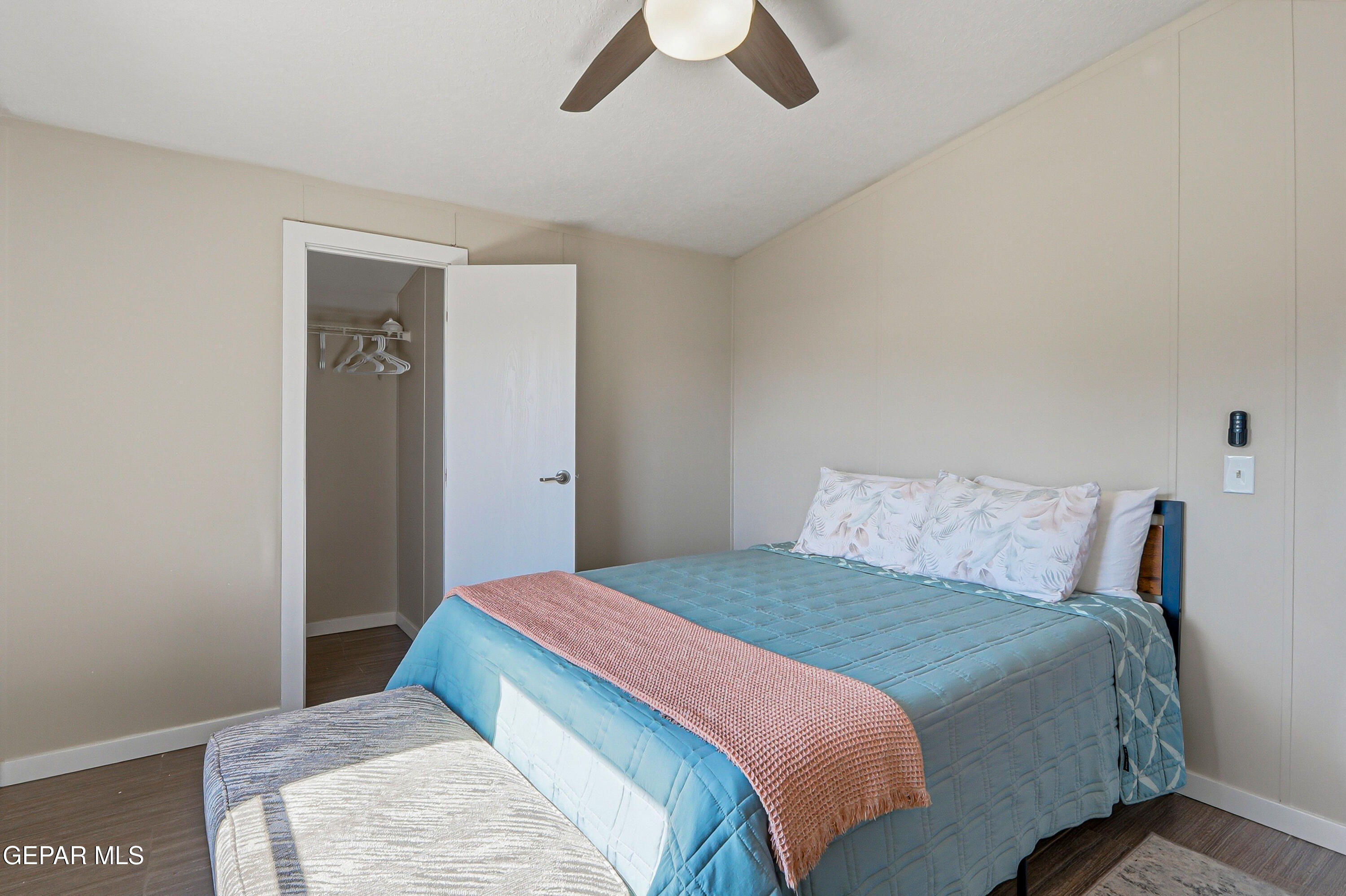 2901 Cook Street Truth or Consequences, NM 87901 - Photo 28 of 31 a bedroom with a large bed and a chandelier