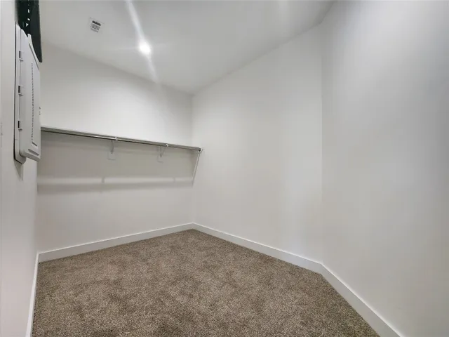 a close view of cabinet a sink and mirror