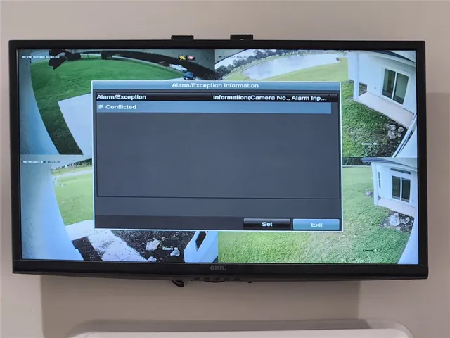 an empty room with a ceiling fan and carpet