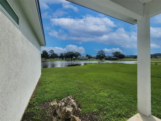 a view of a lake with houses in the background