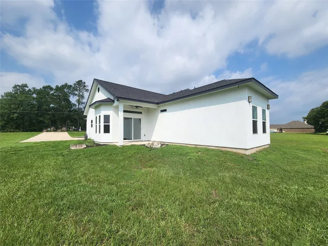 a view of a lake with houses in the background