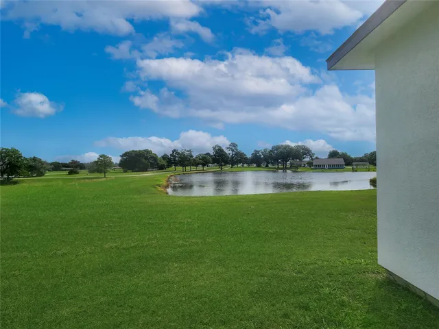 a view of a lake with a yard