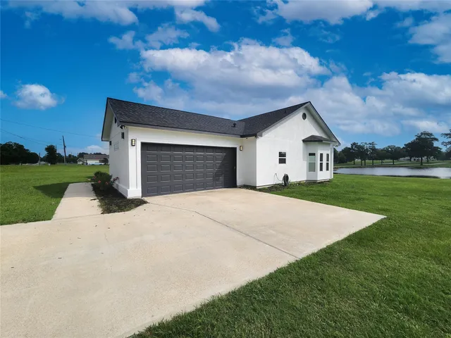 a white house with a yard