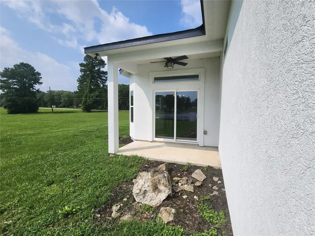 a view of a backyard of the house