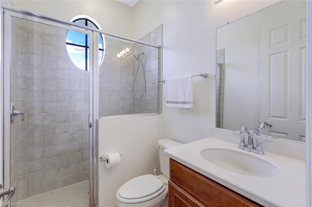 1276 Kendari Terrace Naples, FL 34113 - Photo 23 of 31 a bathroom with a sink toilet and shower