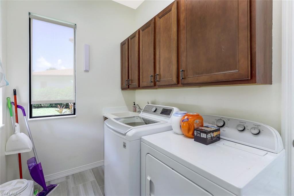 1276 Kendari Terrace Naples, FL 34113 - Photo 24 of 31 a utility room with sink washer and dryer