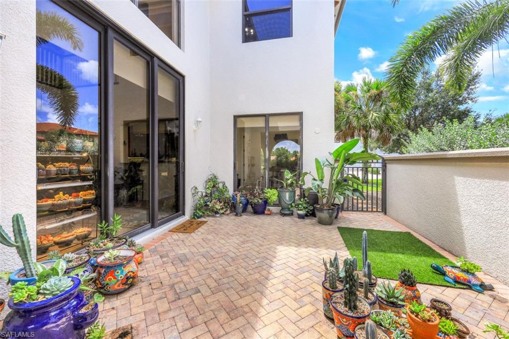 1276 Kendari Terrace Naples, FL 34113 - Photo 26 of 31 a front view of a house