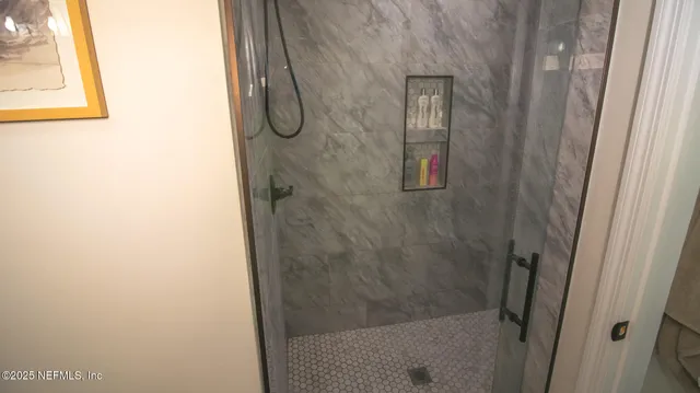 a spacious bathroom with a granite countertop sink and a mirror