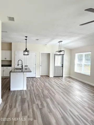 a kitchen with a stove and a microwave