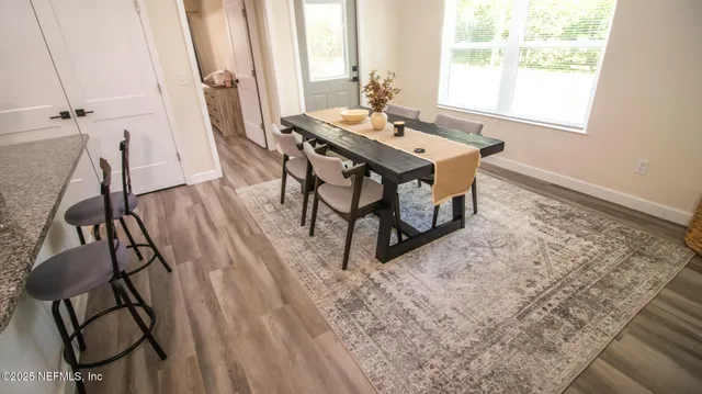 a view of a workspace with furniture and window