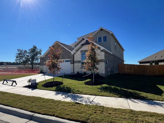 a view of kitchen and hall with wooden floor