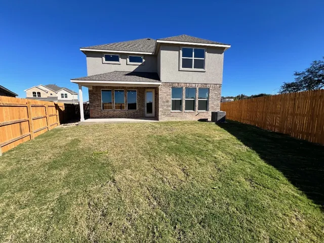 a view of a swimming pool with chairs