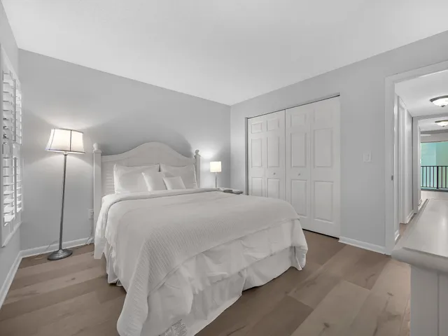 a bedroom with a bed and closet