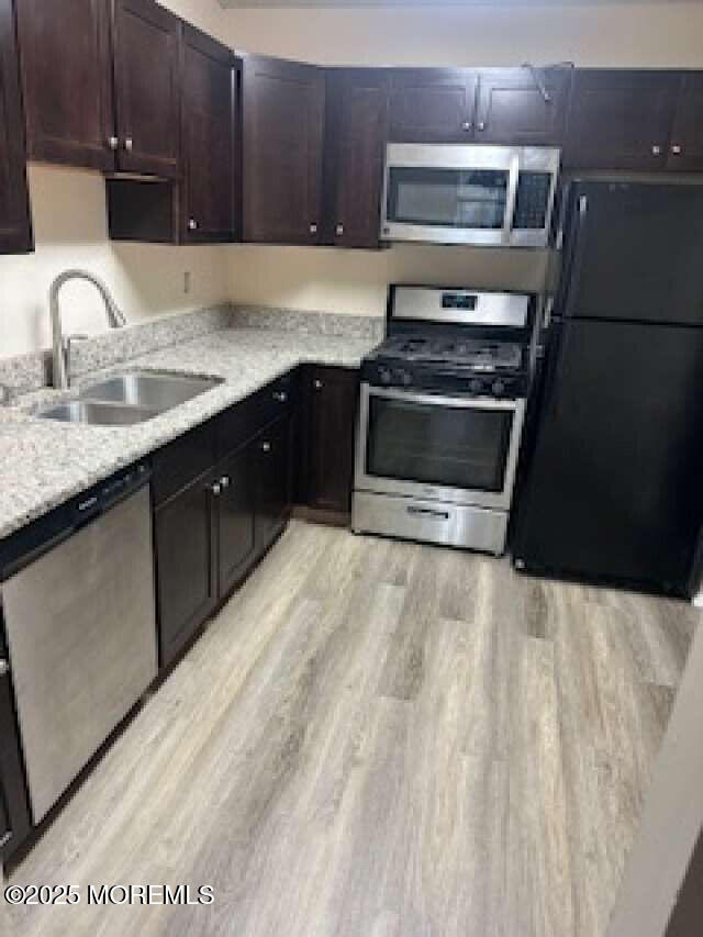 702 Goldthread Court Jackson, NJ 08527 - Photo 11 of 20 a kitchen with a sink stove and cabinets